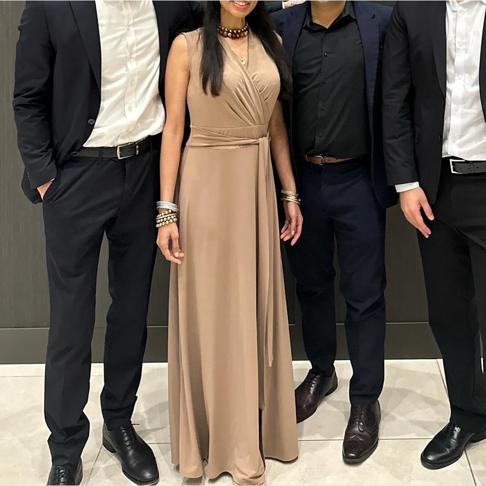 Long tan beige dress with a waist belt. Can be worn in front or bow tie in back